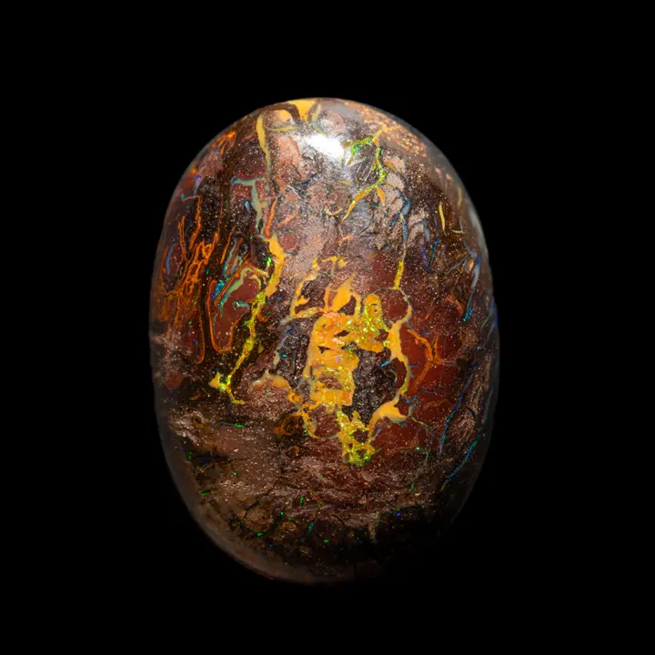 Natural Australian Koroit Opal, 30.9 carat shiny cabochon with oxidized earth matrix and glossy colored filaments mostly green-yellow
