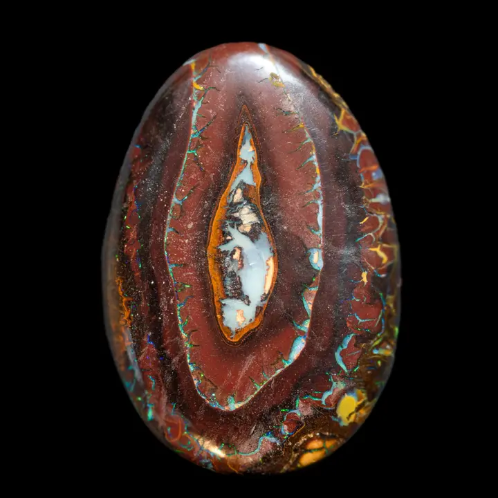 Natural Australian Koroit Opal, large 77.4 carat medallion finely chiseled and opalized on colorful tracery, contrasting in a valley or crater landscape opalized by time
