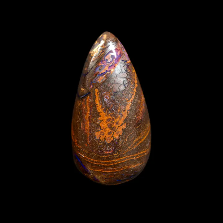 Natural Australian Koroit opal, 33.4 carat drop with ochre-yellow designs and ribbon of purple and parmony shine