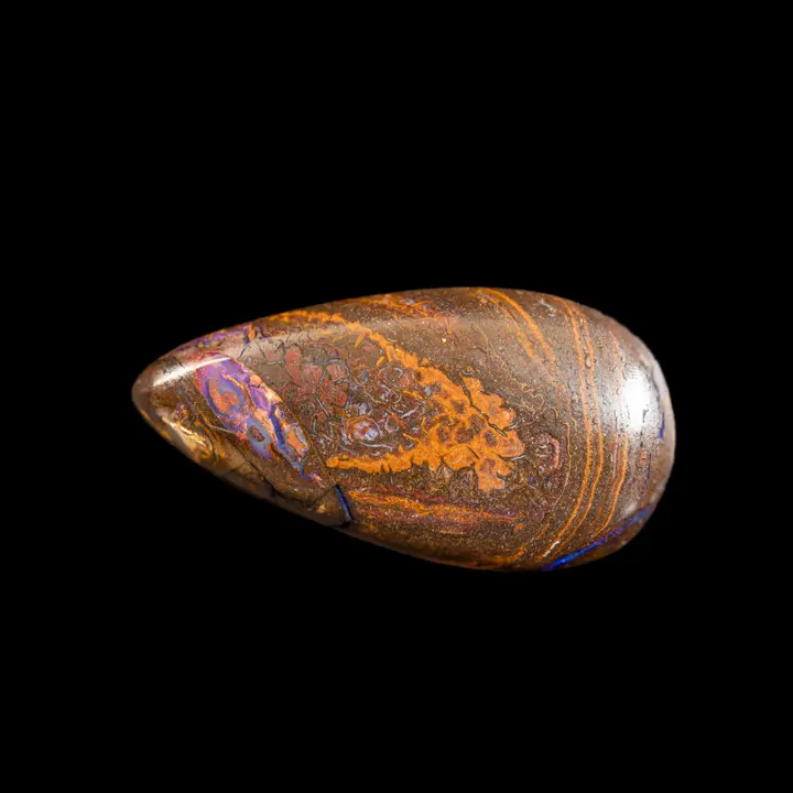 Natural Australian Koroit opal, 33.4 carat drop with ochre-yellow designs and ribbon of purple and parmony shine