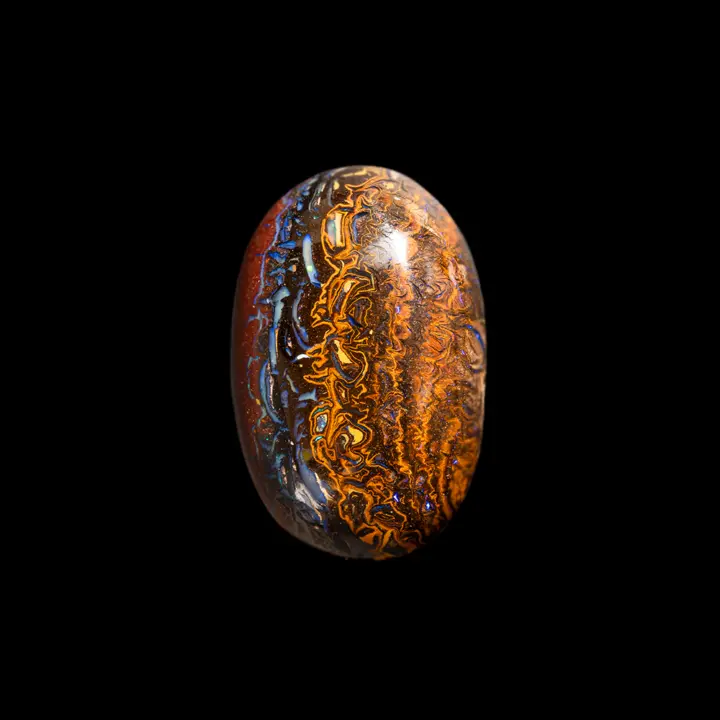 Koroit Australian natural opal, sophisticated 38.4-carat cabochon with colourful, contrasting interlacing, half ochre, half opalized blue and studded with purple micro shine