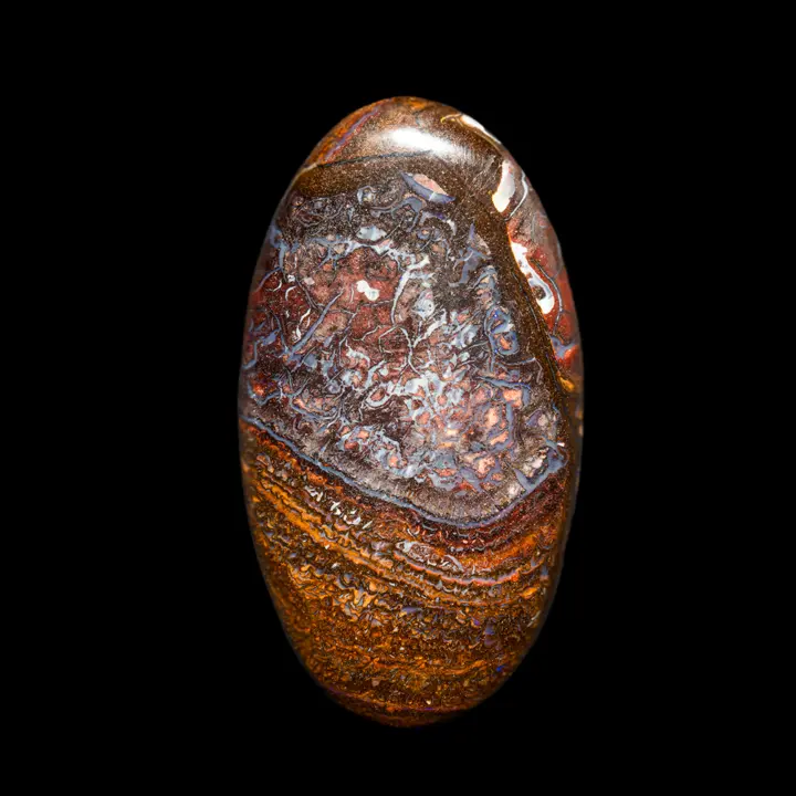 Natural Australian opal from Koroit mines, large 96.4 carat cabochon finely serrated with parm, grey-blue, ochre and ochre-red. A few dots of purple shine