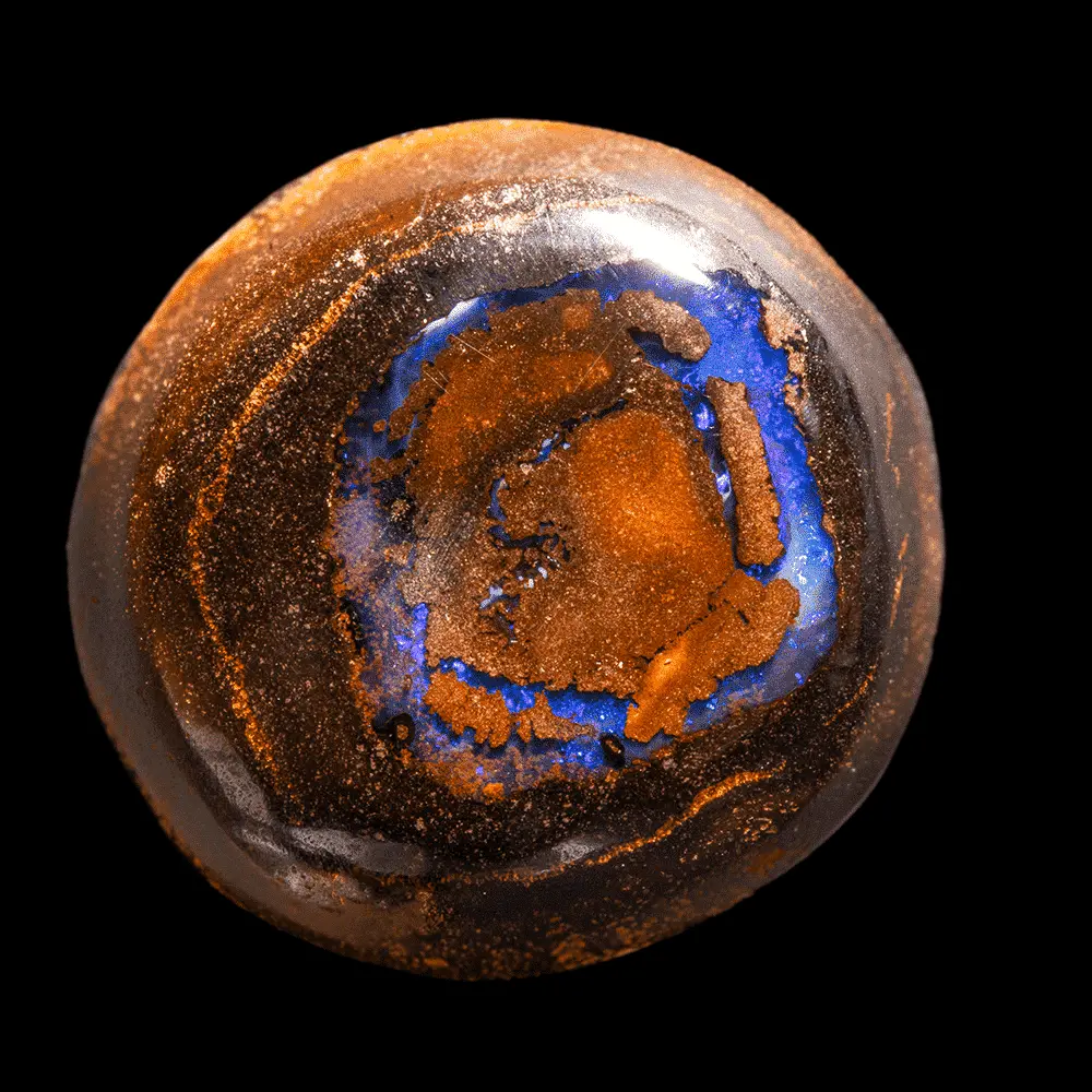Opale naturelle australienne des mines Koroit, forme ronde de 27,2 carats à cercle opalisé brillant bleu évoquant un oeil