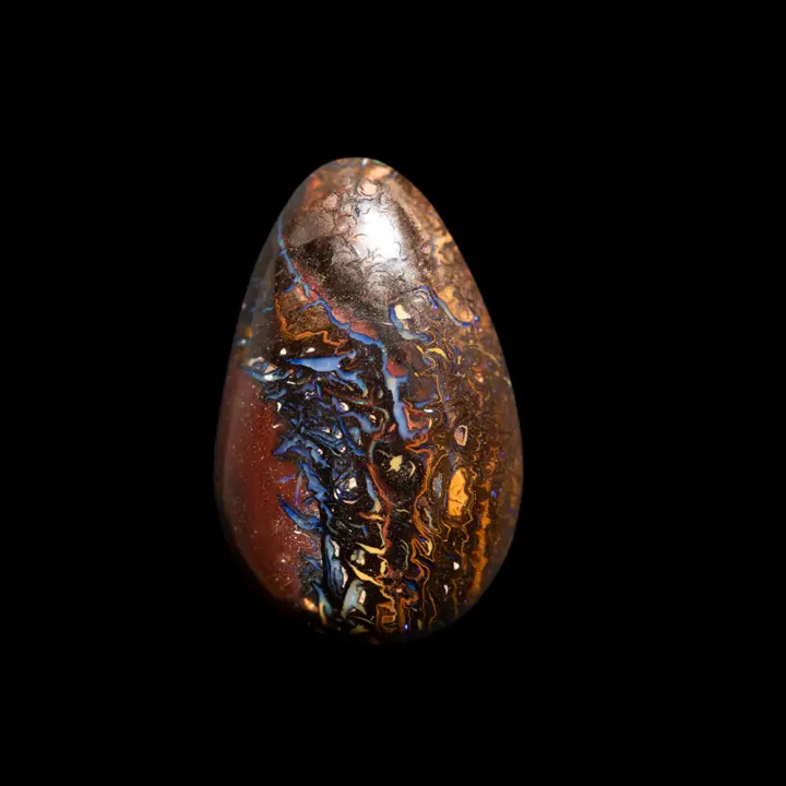 Natural Australian opal from the Koroit mines, 36.2 carat teardrop shape with blue tracery contrasting with its red ochre matrix