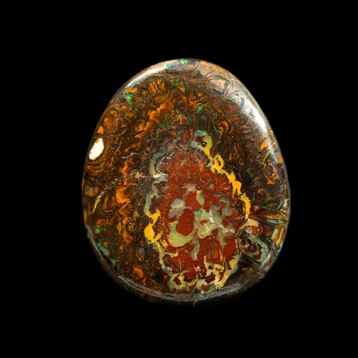 Natural Australian opal from the Koroit mines, 27 carat drop shape with colored, contrasting and opalized patterns.