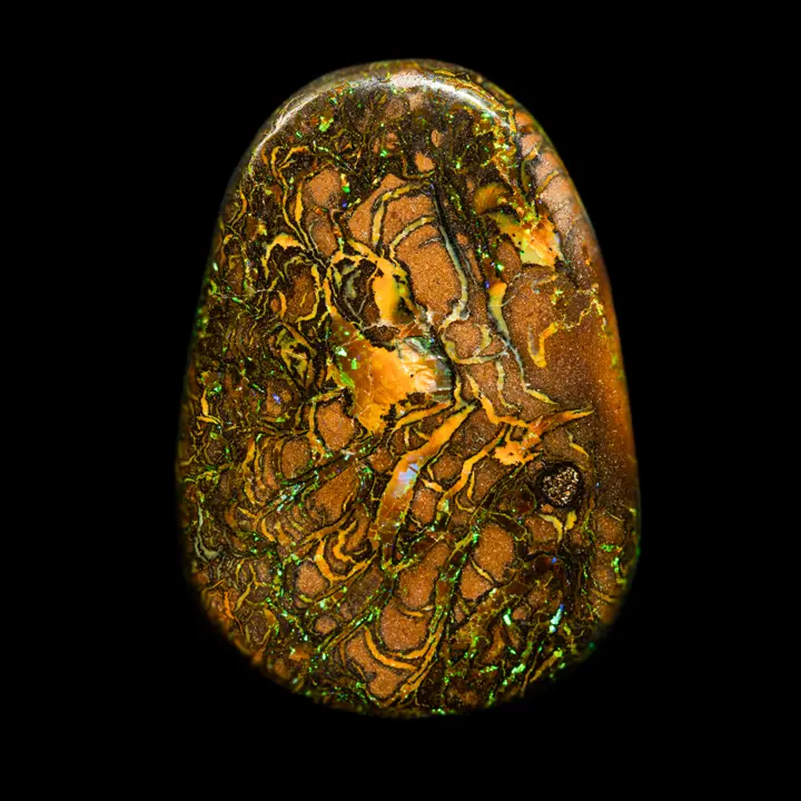 Natural Australian opal from Koroit mines, beautiful 29.7 carat free-form cabochon polished on both sides. Yellow-gold patterns accented with black intermingle with very bright green-yellow shimmers