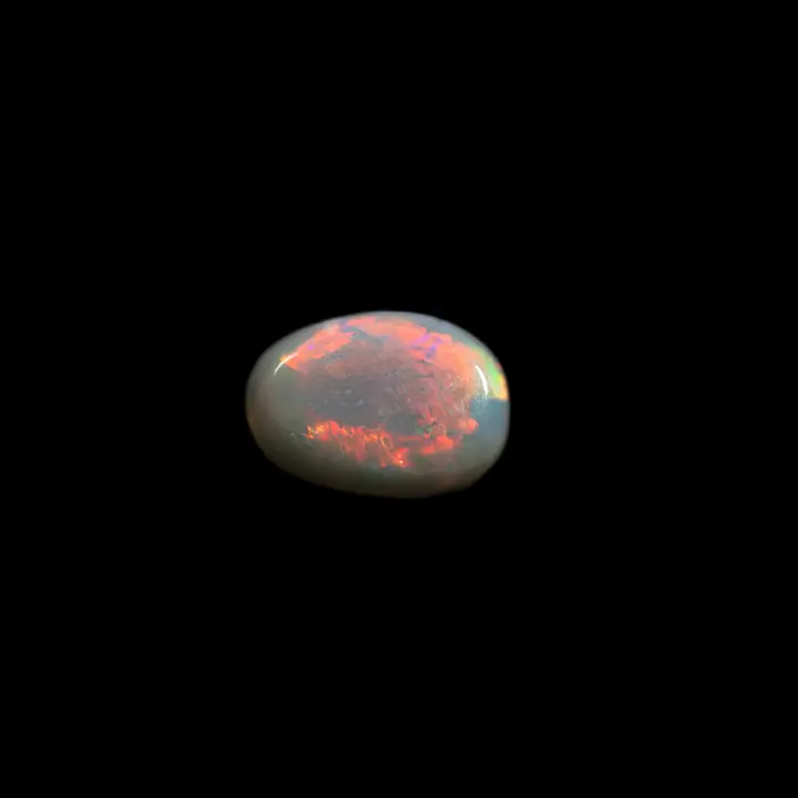 Natural Australian opal from the mines of Lightning Ridge, 0.9 carat cabochon, flaming red semicircle colored waves and resplendent multicolored echoes, a gorgeous black opal!
