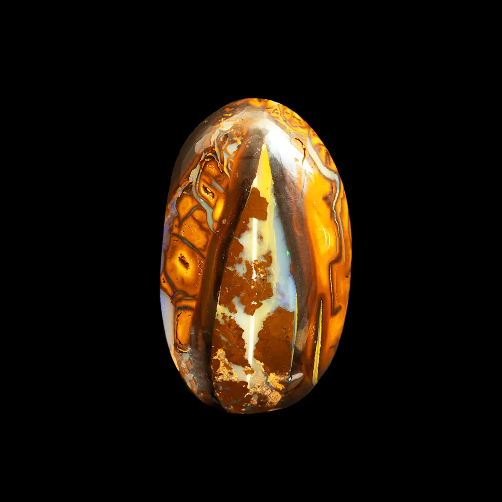 Natural Australian opal from the Koroit mines, oval shape reminiscent of a 25.4-carat seed with yellow and brown ochre colours on a blue glossy opalisation nut