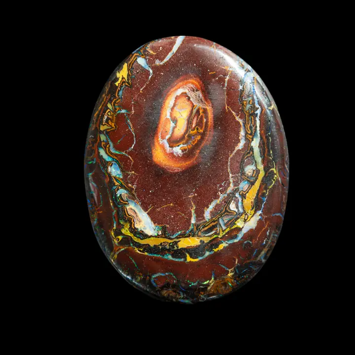 Natural Australian opal from the Koroit mines, large oval with princess necklaces of 29.5 carats, multicolored and iridescent on a red ochre matrix typical of the bush, sumptuous back to no longer fear rocks