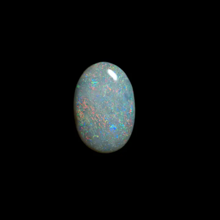 Natural Australian opal from Coober Pedy mines, 0.9 carat cabochon with clear matrix and regular and multi-coloured shines