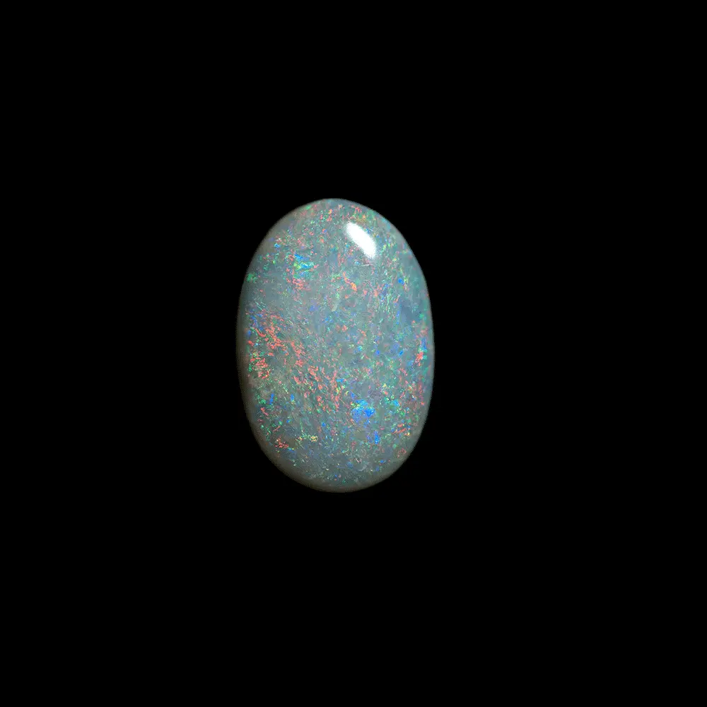 Opale naturelle australienne des mines de Coober Pedy, cabochon de 0,9 carat à matrice claire et brillances colorées régulières et multicolores