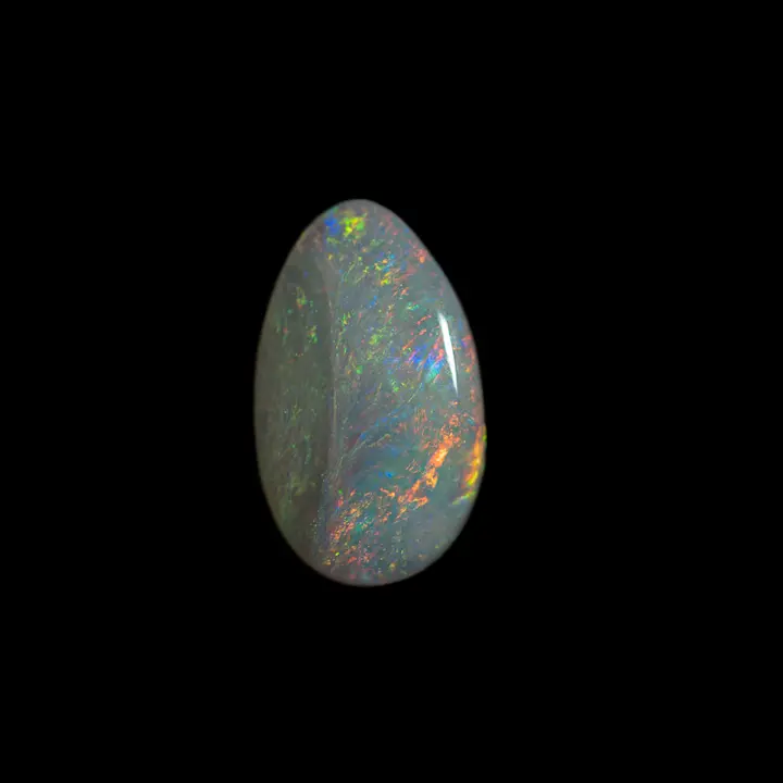 Natural Australian opal from the Coober Pedy mines, 1.4 carat lanceolate shape reminiscent of the blade of a leaf with a clear matrix and green and orange shines