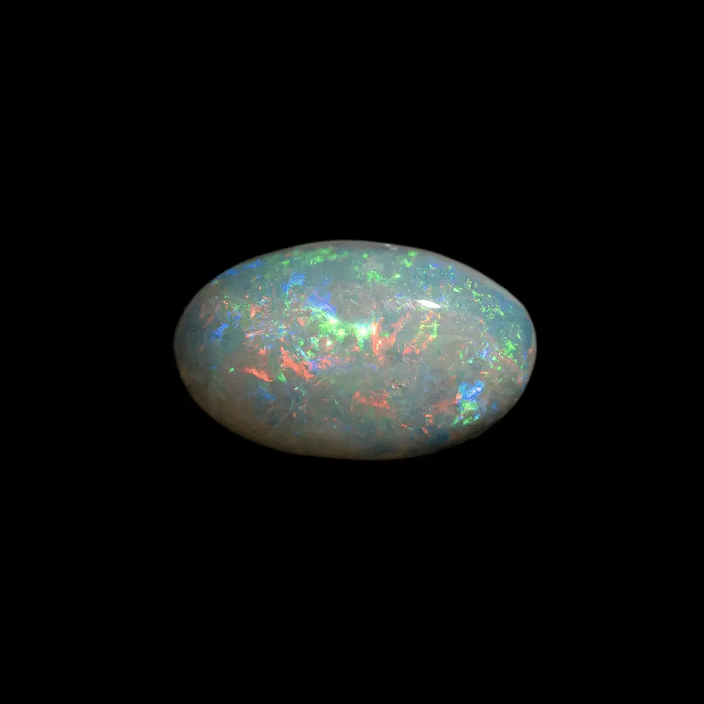 Opale naturelle australienne des mines de Coober Pedy, petit coquillage opalisé de forme ovale de 1,3 carat, sa matrice est très claire et ses brillances multicolorées