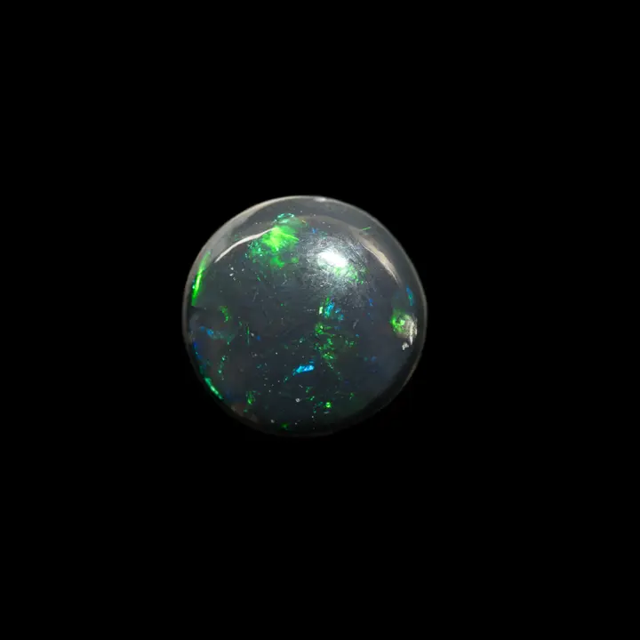 Natural Australian opal from the Lightning Ridge mines, 1.5 carat half-sphere with very black matrix and subtle green and blue shines