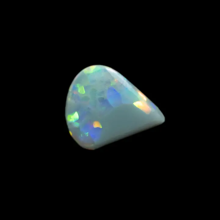 Natural Australian opal from the Lightning Ridge mines, 1.2 carat triangular teardrop shape with crystalline black matrix and multi-coloured iridescent slabs