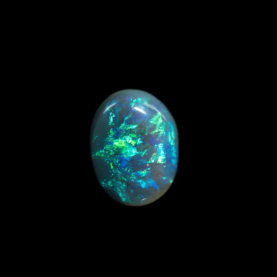 Natural Australian opal from the mines of Lightning Ridge, black crystal cabochon with blue and green iridescence evoking atmospheric storms