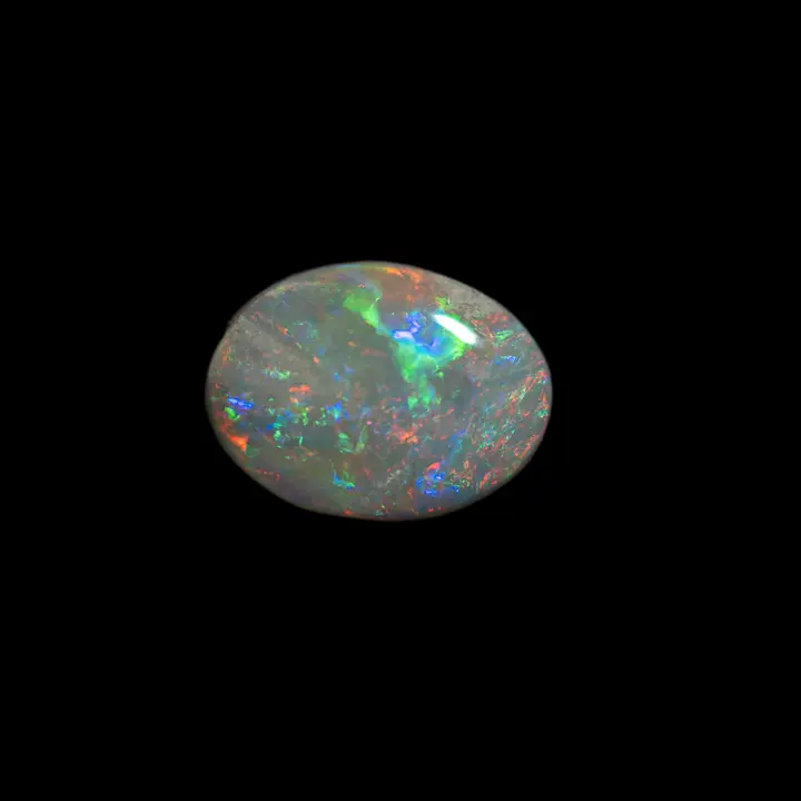 Opale naturelle australienne des mines de Coober Pedy, cabochon ovale de 1,4 carat à matrice claire et extra brillances multicolorées