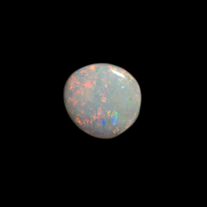 Australian natural opal from the Coober Pedy mines; 1.3 carat cut in free form to retain all its multicolored shine and clear base