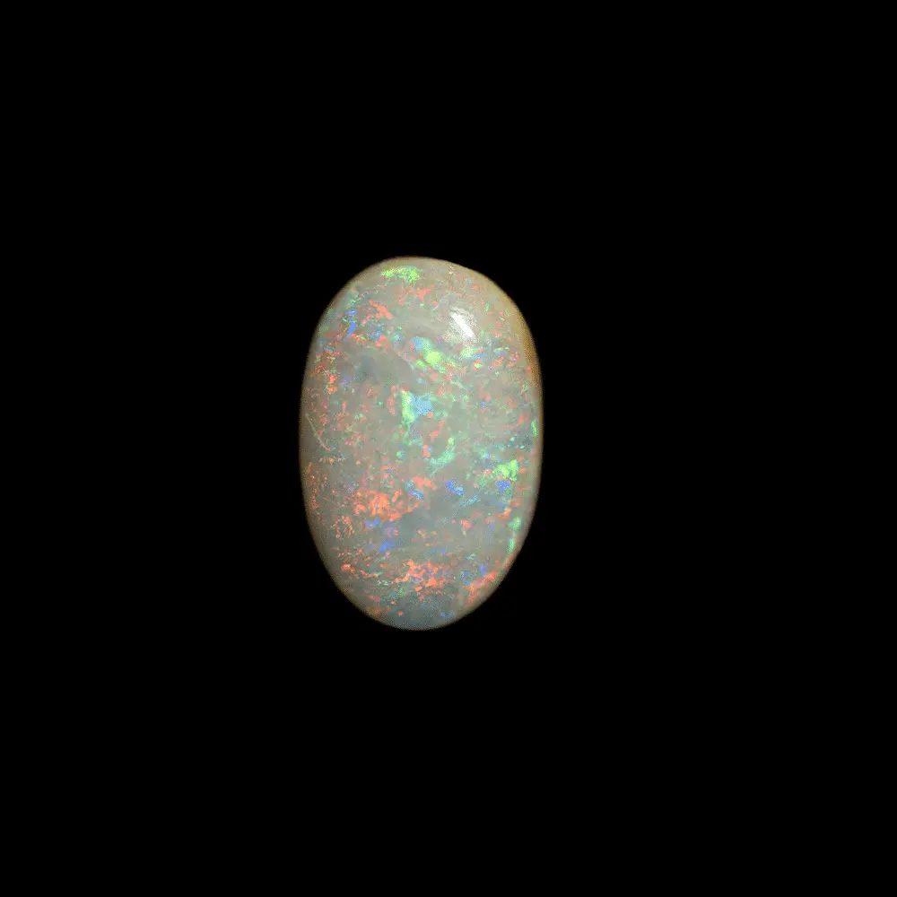 Opale naturelle australienne des mines de Coober Pedy, cabochon classique de 1,1 carat à matrice claire opalescente et couleurs brillantes classiques de ces mines