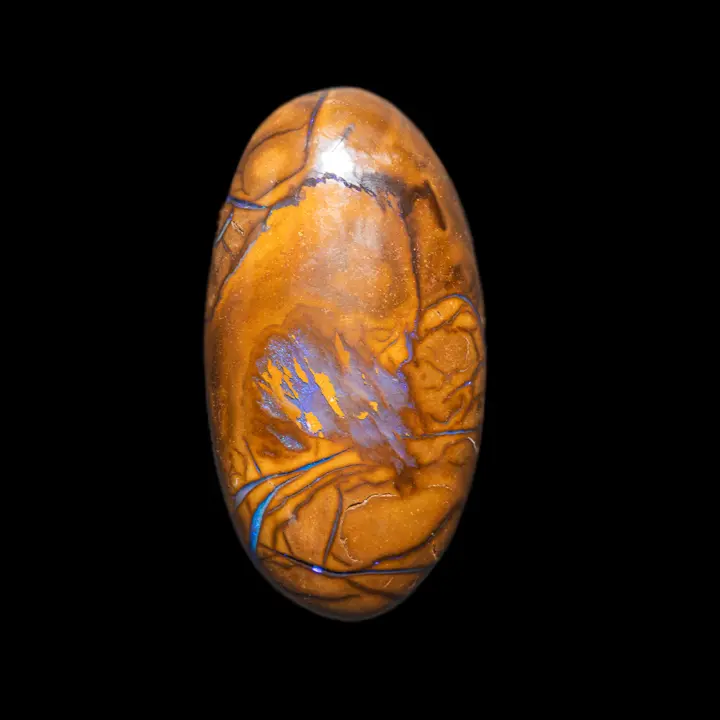 Natural Australian opal from the Koroit mines, 28.1 carat oval cabochon with yellow ochre matrix decorated with brilliance in fillets and blue to purple brushstroke
