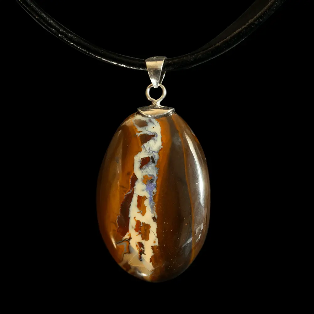 Natural Australian opal from the Koroit mines, 31 carats, mounted as a pendant on 925 silver, its original chain motif in the soft color of vanilla is entwined with ribbons of chocolate and caramel.