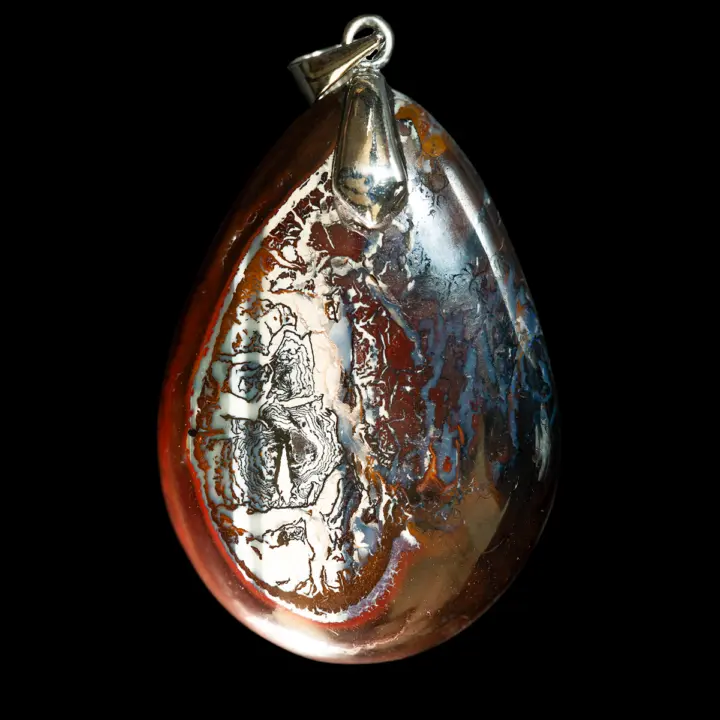 Natural Australian opal from the Koroit mines, a magnificent landscape cabochon with intense contrasting colors; a matrix of dark red oxidized earth contrasting with snow-white, blue-grey and fine black calligraphic patterns.