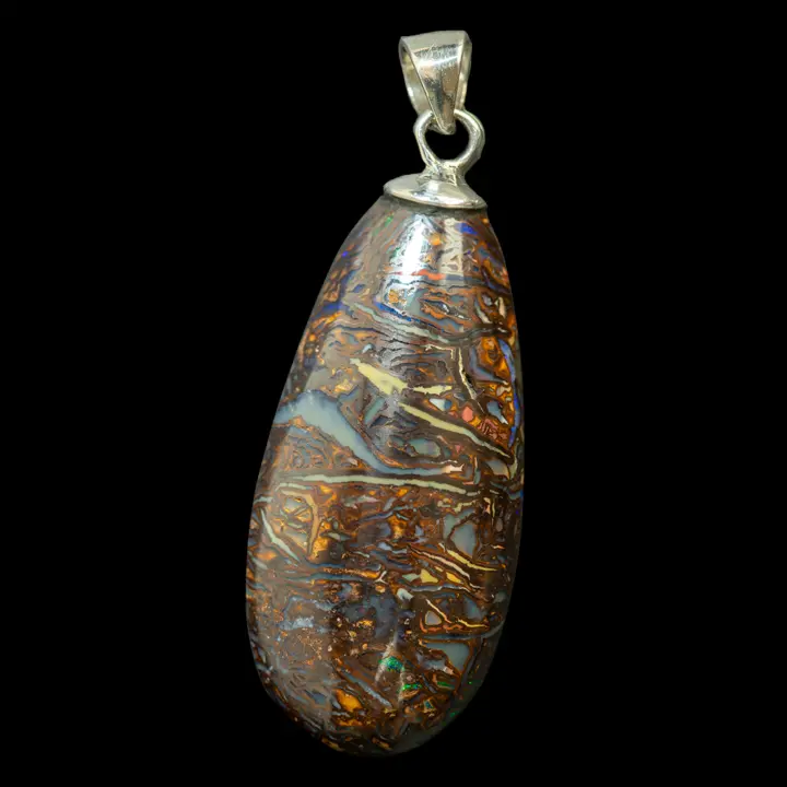 Natural Australian opal from the Koroit mines, 22.9 carat drop shape mounted in a silver pendant, striated with coloured lines on a dark background for a discreet ensemble punctuated by a few green glints.