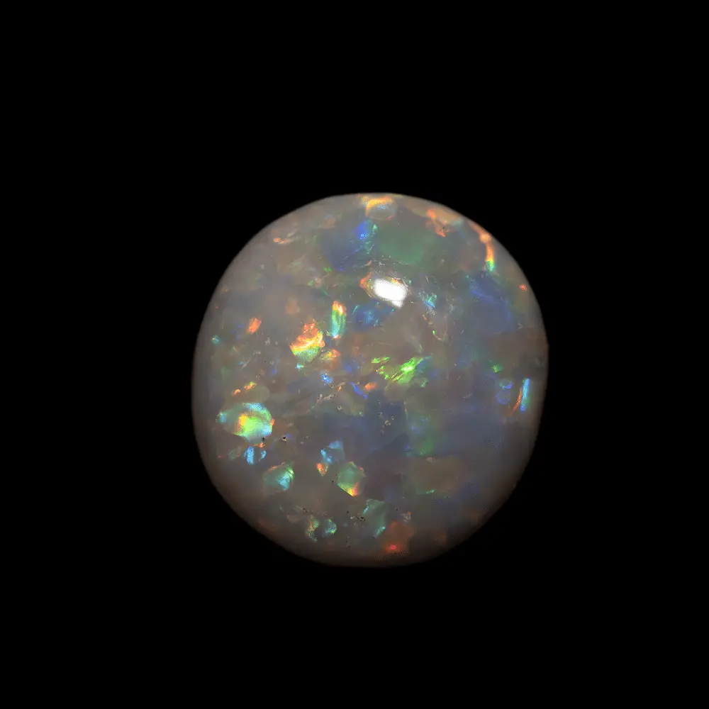 Natural Australian opal from the Lightning Ridge mines, free form 2.7 carats, semi-spherical polished on one side covered with multicolored rainbow-colored prisms.