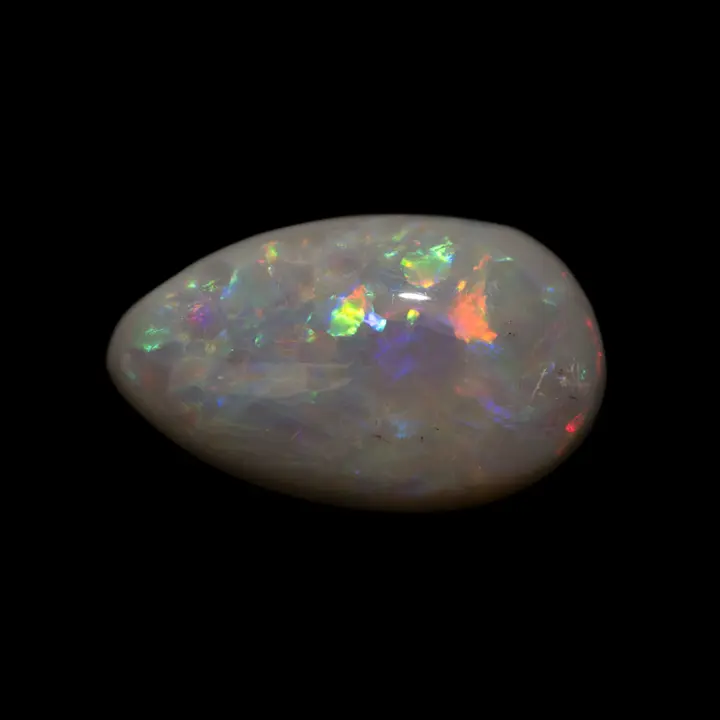 Natural Australian opal from the Lightning Ridge mines, 2.7 carat teardrop-shaped cabochon with dark matrix and soft iridescence, multicolored  