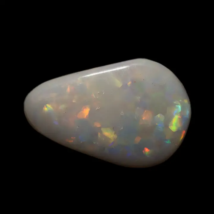 Natural Australian opal from the Lightning Ridge mines, 2.3 carat dark milky matrix teardrop and large multicolored iridescent slabs, some natural inclusions on the surface.